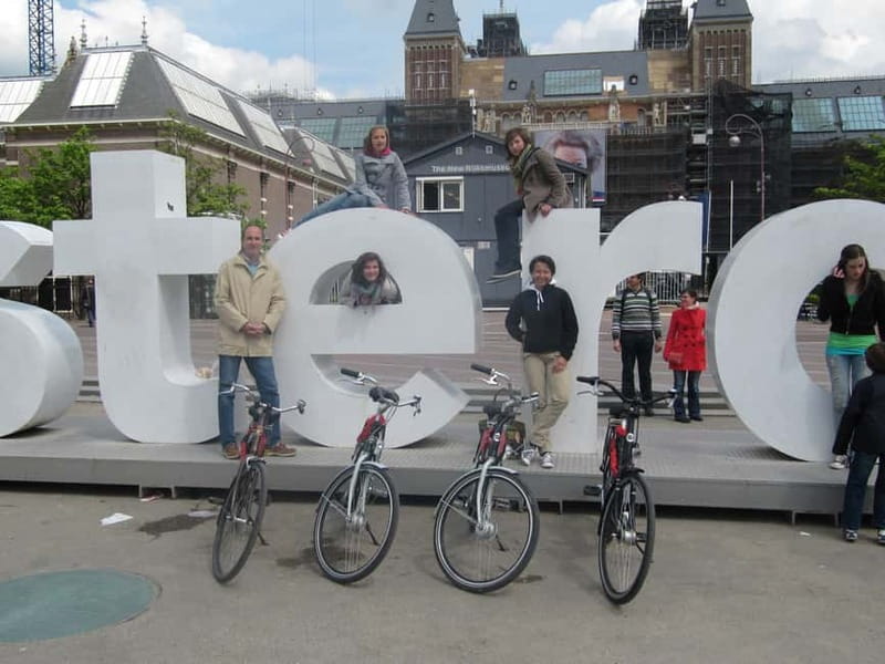 Amsterdam:: Bike Rental with Free Self-Guided Tour - Following the app through Amsterdam