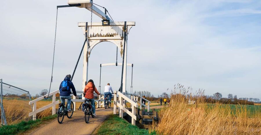 Amsterdam: Dutch Countryside E-Bike with Cheese & Clogs - Leaving Amsterdam by ferry and bike