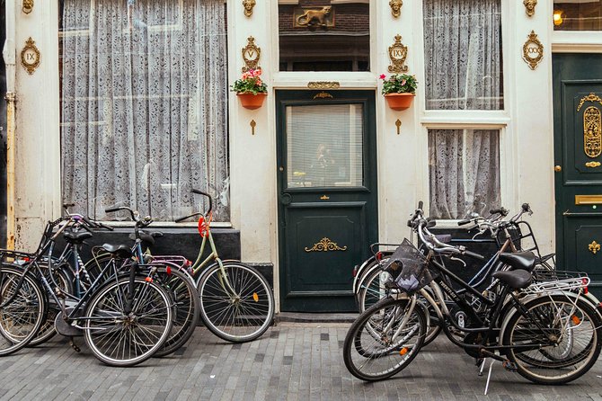 Amsterdam PRIVATE Bike Tour With Locals: Bike & Local Snack Included - Starting at Centraal Station with a rental bicycle