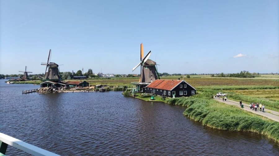 Amsterdam: Zaanse Schans Windmills Bike Tour with Guide - Riding beside the Zaan River