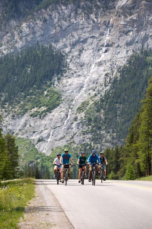 Banff: Mountain Lakeside Guided E-Bike Tour - Lake Minnewanka and the town below the water