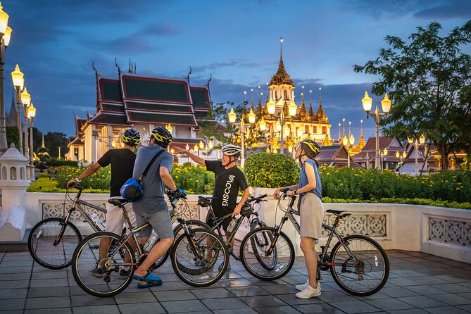 Bangkok: Night Bike Tour with Temples & Flower Market Visit - Crossing the Chao Phraya by local ferry