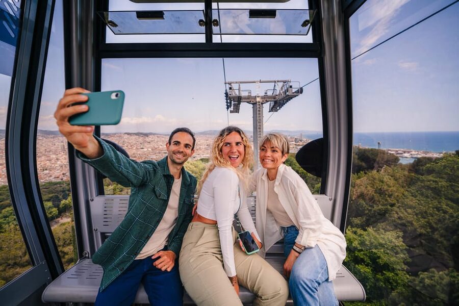 Barcelona: E-Bike Tour with Montjuic Cable Car & Boat Ride - Taking the funicular up Montjuïc