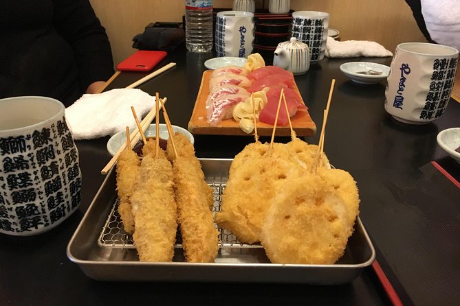 Eat, Drink & Cycle: Osaka Foodie Bike Tour - Sushi and kushikatsu finish the route