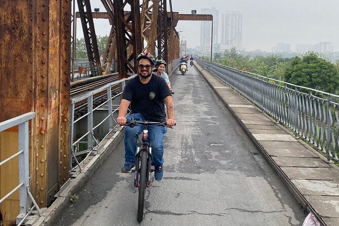 Hanoi City Bike Tour through Banana Island & Food Tasting - Railway tracks, cafés, and the city’s unusual rhythms