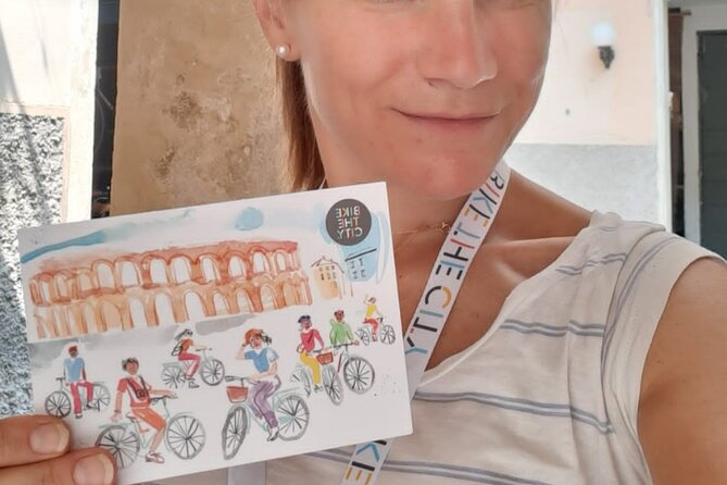 Highlights and hidden gems Verona Bike Tour - Crossing the rebuilt Scaliger Bridge to San Zeno