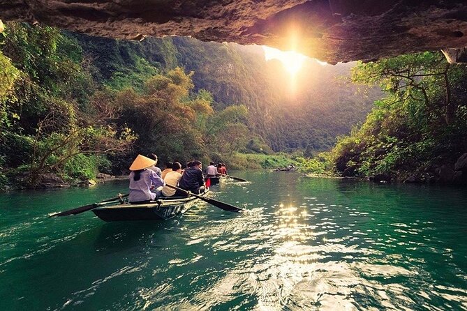 Hoa Lu - Tam Coc - Ninh Binh Day Tour: Biking, Visit Local Family - Rowing through Tam Coc’s limestone country
