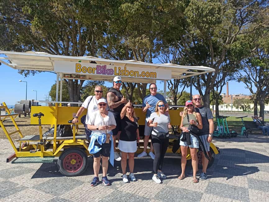 Lisbon: 1-Hour Beer, Sangria or Wine Bike Sightseeing Tour - Pedaling toward the 25 de Abril Bridge