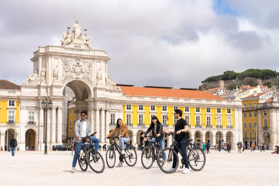 Lisbon: Guided Bike Tour, Helicopter Flight, and Boat Trip - Seeing Lisbon from a three-seat helicopter