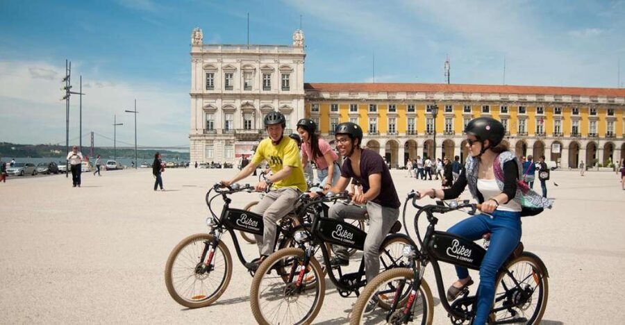 Lisbon: Hills, Alfama, and Mouraria Tour by Electric Bike - Commerce Square and the move into old Lisbon