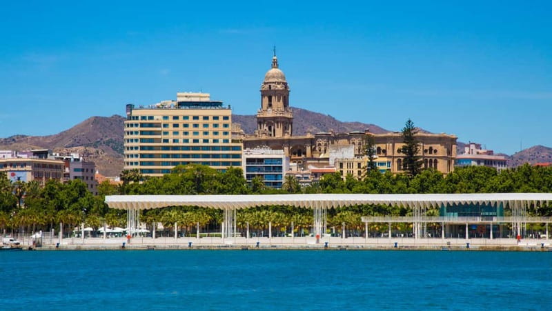 Malaga: Castle Hill and Fisherman Village E-Bike Tour - Starting through central Malaga and the street art districts