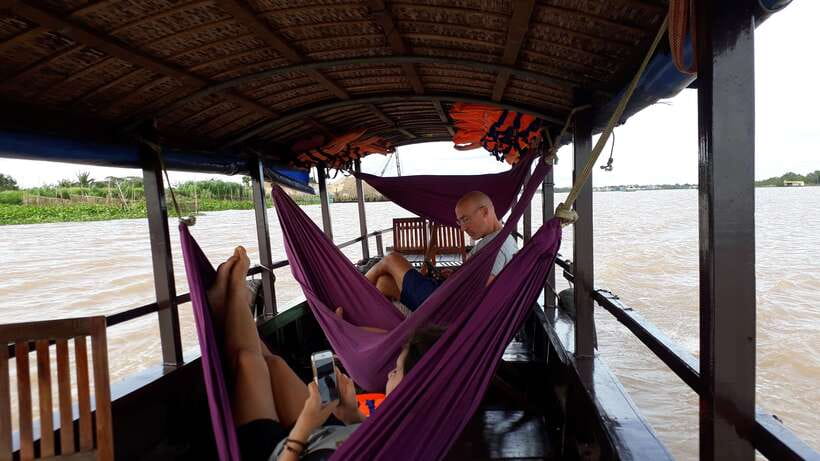Mekong Day Tour by Car:Cai Be market, Local Island & Cycling - Fruit, music, and a hand-rowed sampan