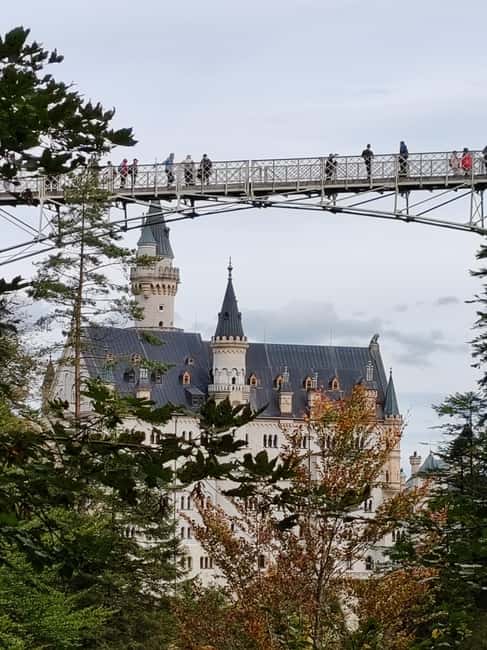 Munich: Neuschwanstein Castle by Bus with Alpine Bike Ride - The walk down and return to Munich