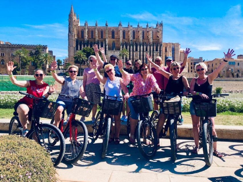 Palma de Mallorca: Guided Bicycle Tour with Tapas & a Drink - Turning into Palma’s medieval lanes