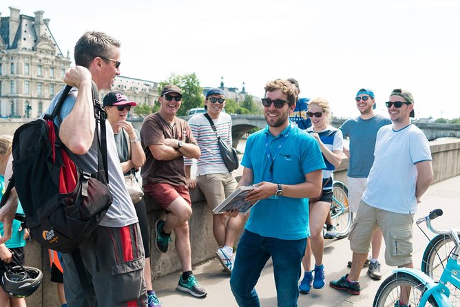 Paris Highlights Bike Tour: Eiffel Tower, Louvre and Notre-Dame - Rue Cler gives the ride a local pause