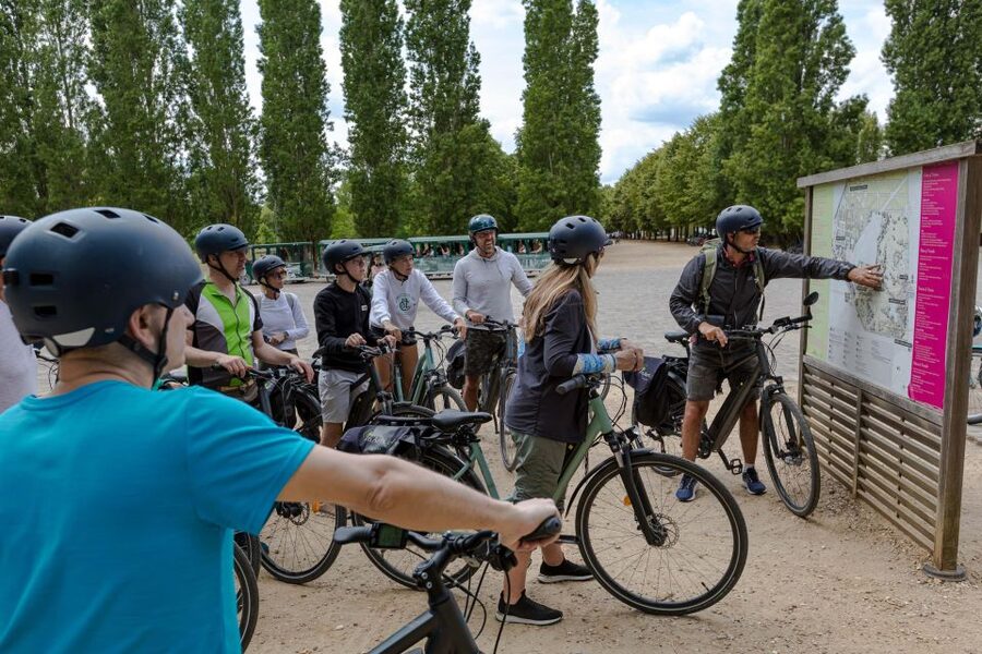 Paris: Versailles Palace and Queen Hamlet E-Bike Tour - Building lunch at Notre-Dame Market
