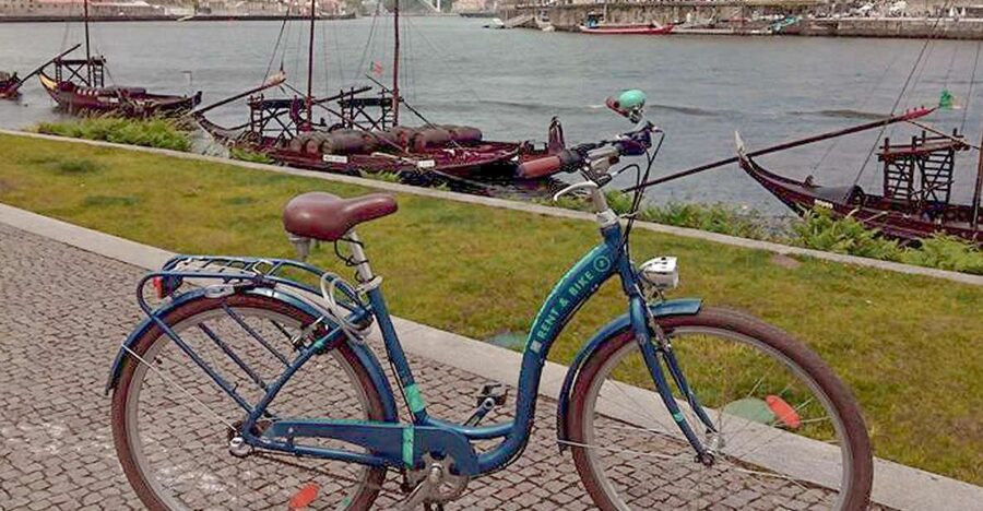 Porto: Self-Guided Bike and Boat Tour with Port Wine Tasting - The six-bridge cruise on a traditional rabelo boat