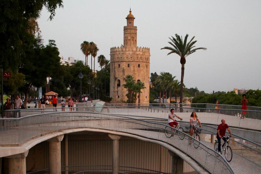 Seville: Guided Sunset Bike Tour - Santa Cruz brings the ride into Seville’s narrow lanes