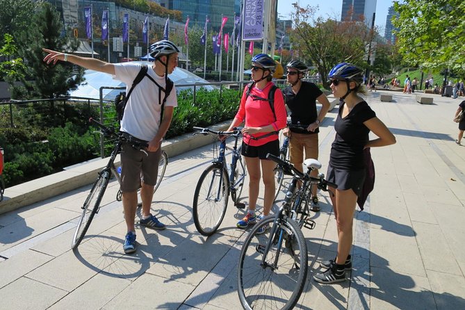 Stanley Park & Downtown - Vancouver Bike Tours - The seawall, Girl in a Wetsuit, and Lions Gate Bridge